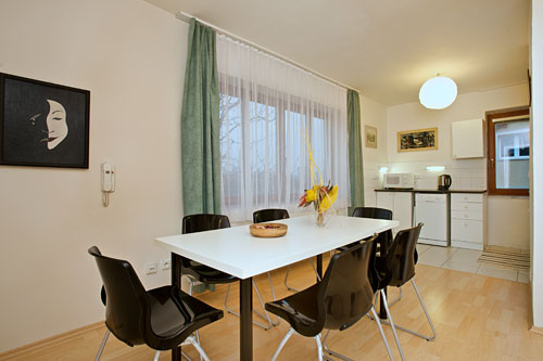The kitchen has a large dining table for six people. There are 2 spare chairs in case a larger family needs to meet at lunch or dinner time.