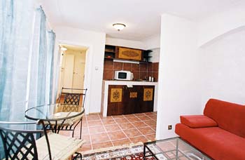 The living room looking into the kitchen in Prokopska apartment. Prokopska, an apartment offered by Prague Accommodations, is near to Prague’s Lesser Town Square or Malostranske Namesti.
