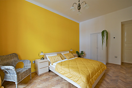 The façade has a lively rhytm decorated with stucco ornaments and balconies - two of those belongs to this apartment