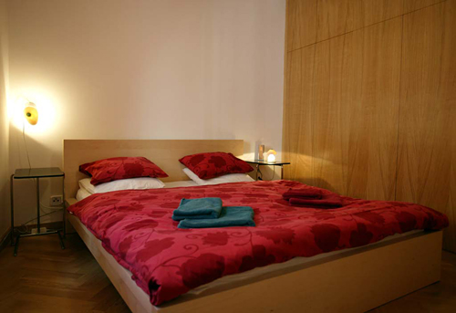 
Master bedroom featuring plenty of closet space in appartament 6 in Janska 7. Prague Hotel apartment accommodation offered  by accommodations in Prague. This short-term apartment rental Accomodation is close to Prague’s Charles Bridge and Malostranske Namesti is in Mala Strana near Nerudova Street and the US Embassy and Petrin Hill